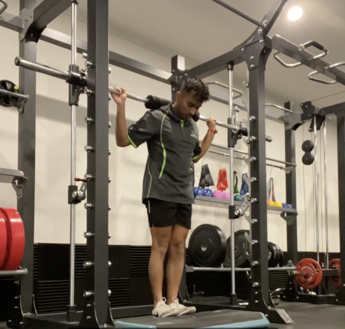 Eccentric Heel Drop with Barbell and Block Step